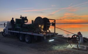 Welljet truck on job site at dusk.